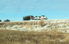 Bock's Service heavy-duty tow truck pulling a milk truck